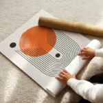 poster abstrait orange et noir enroule.webp