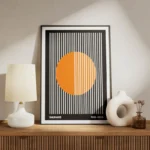poster cercle orange sur fond noir meuble.webp