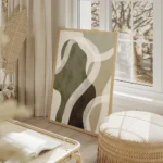 affiche abstraite aux formes vertes et beiges avec des lignes blanches et une te salon beige.webp