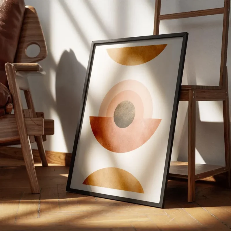 affiche abstraite avec des cercles et demi cercles terracotta et dores sur fond encadre.webp