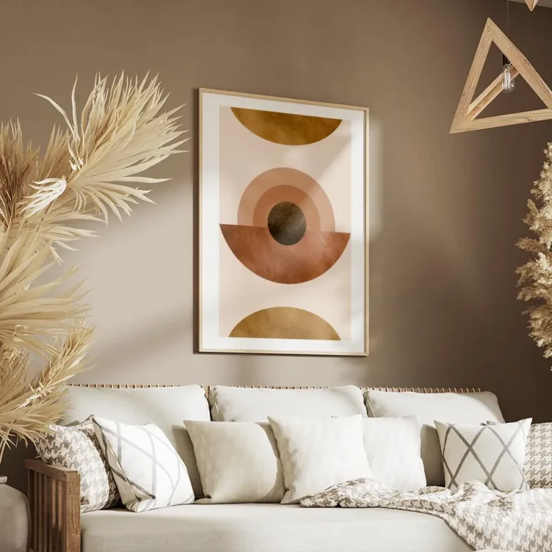 affiche abstraite avec des cercles et demi cercles terracotta et dores sur fond salon.webp