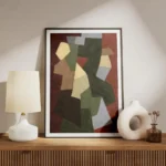 affiche abstraite avec des formes geometriques beige vert marron et gris sur un meuble.webp