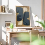 affiche abstraite avec des formes organiques arrondies bleu fonce et beige sur u bureau.webp