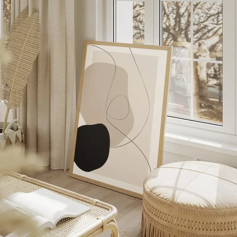 affiche abstraite avec des formes organiques beiges et noires et des lignes fine salon beige.webp