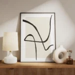 affiche abstraite avec des lignes noires epaisses sur un carre beige clair fond meuble.webp