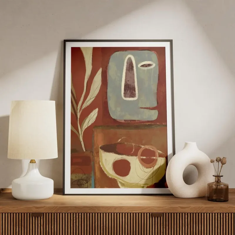affiche abstraite avec un visage bleu et des formes vegetales sur fond rouge un meuble.webp