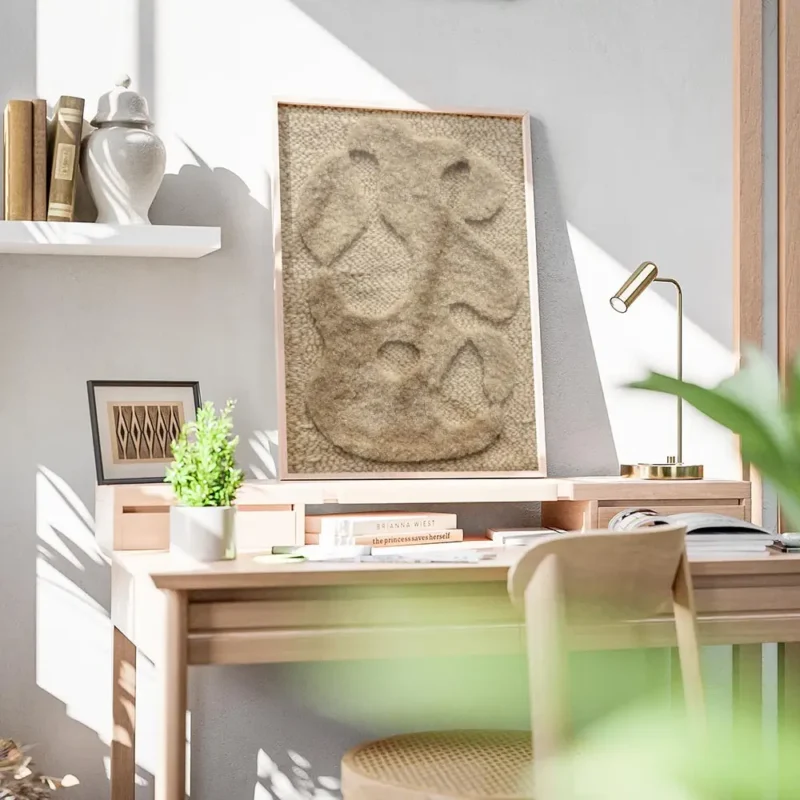 affiche abstraite beige avec des formes organiques texturees sur un fond tricote bureau.webp