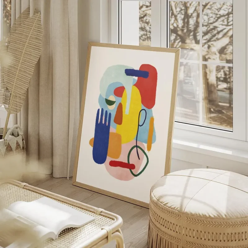 affiche abstraite coloree avec des formes des yeux et une main bleue sur fond bl salon beige.webp