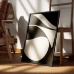 affiche abstraite minimaliste avec des formes courbes beiges sur fond noir textu encadre.webp