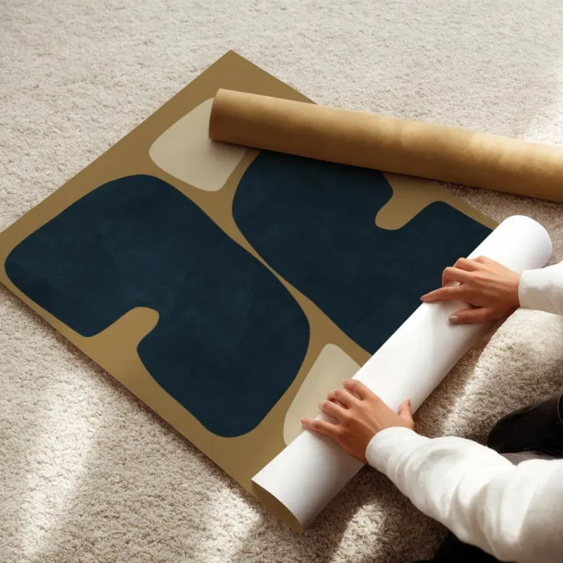 affiche abstraite avec des formes organiques arrondies bleu fonce et beige sur u enroule.webp