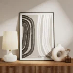 affiche abstraite noir et blanc avec des formes epaisses et organiques sur un fo meuble.webp