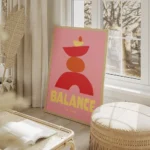 affiche abstraite rose avec des formes empilees rouges jaunes et oranges represe salon beige.webp