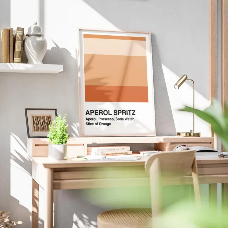 affiche aperol spritz blanche avec des blocs de couleur orange et la typographie bureau.webp