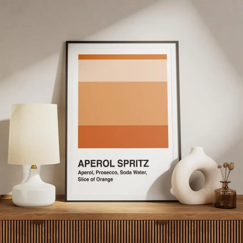 affiche aperol spritz blanche avec des blocs de couleur orange et la typographie meuble.webp