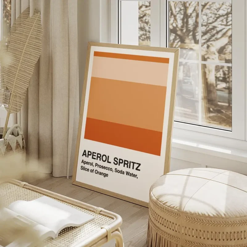 affiche aperol spritz blanche avec des blocs de couleur orange et la typographie salon beige.webp