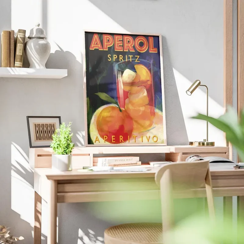 affiche aperol spritz de marco marella typographie orange sur fond bleu verre de bureau.webp