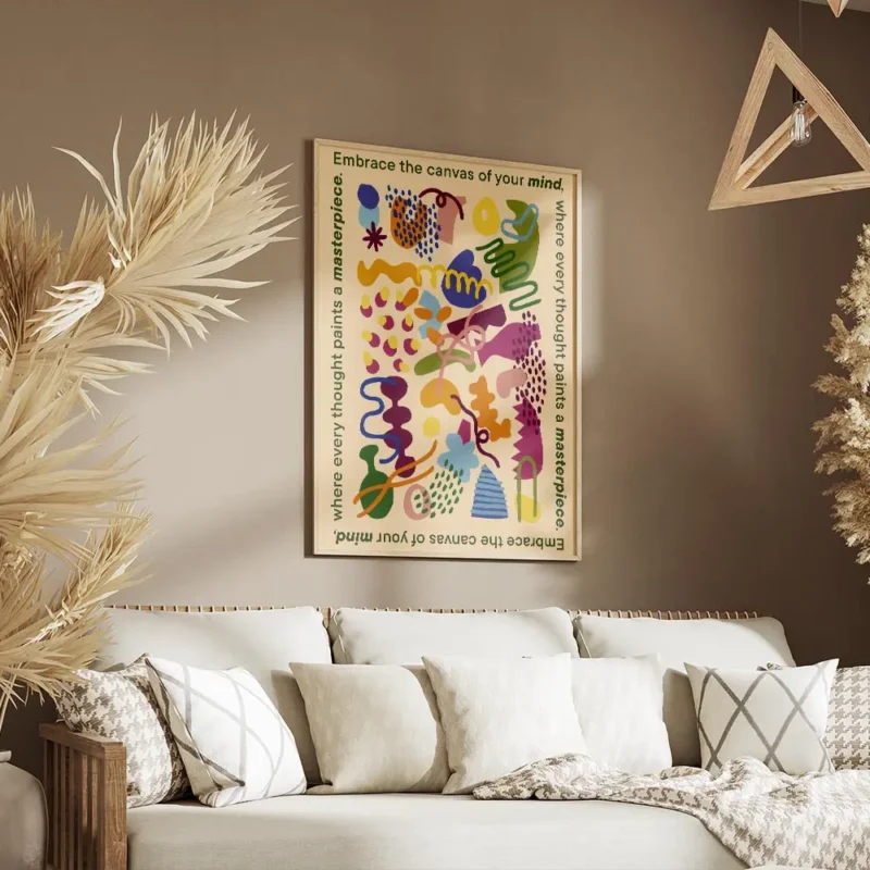 affiche aux formes abstraites et colorees sur fond jaune clair texte vert sur le salon.webp