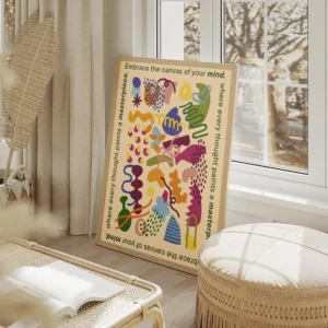 affiche aux formes abstraites et colorees sur fond jaune clair texte vert sur le salon beige.webp