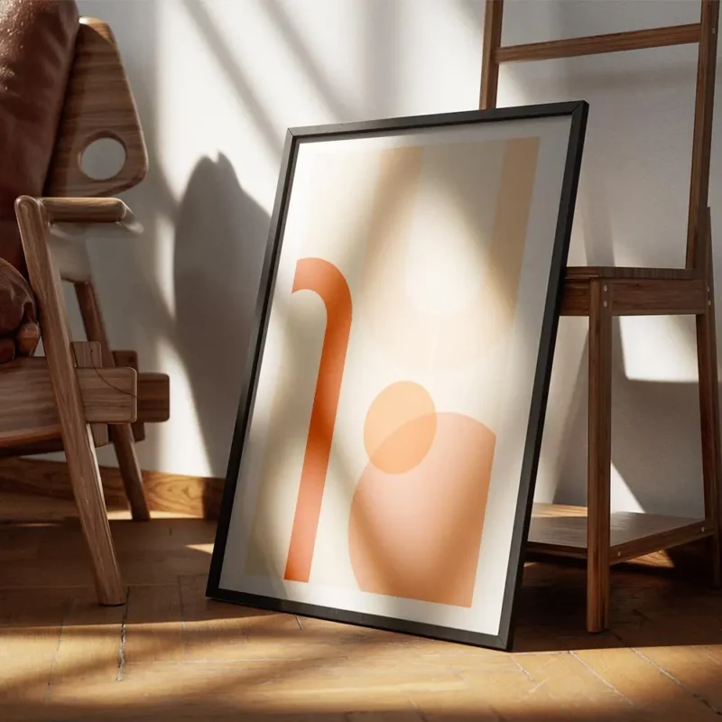 affiche aux formes geometriques orange et peche sur fond beige avec bordure blan encadre.webp