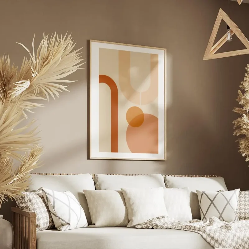 affiche aux formes geometriques orange et peche sur fond beige avec bordure blan salon.webp