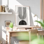 affiche avec arche abstraite en noir composee de lignes et forme noire sur fond bureau.webp