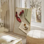 affiche avec des escarpins rouges brillants un livre ouvert et une tasse de cafe salon beige.webp