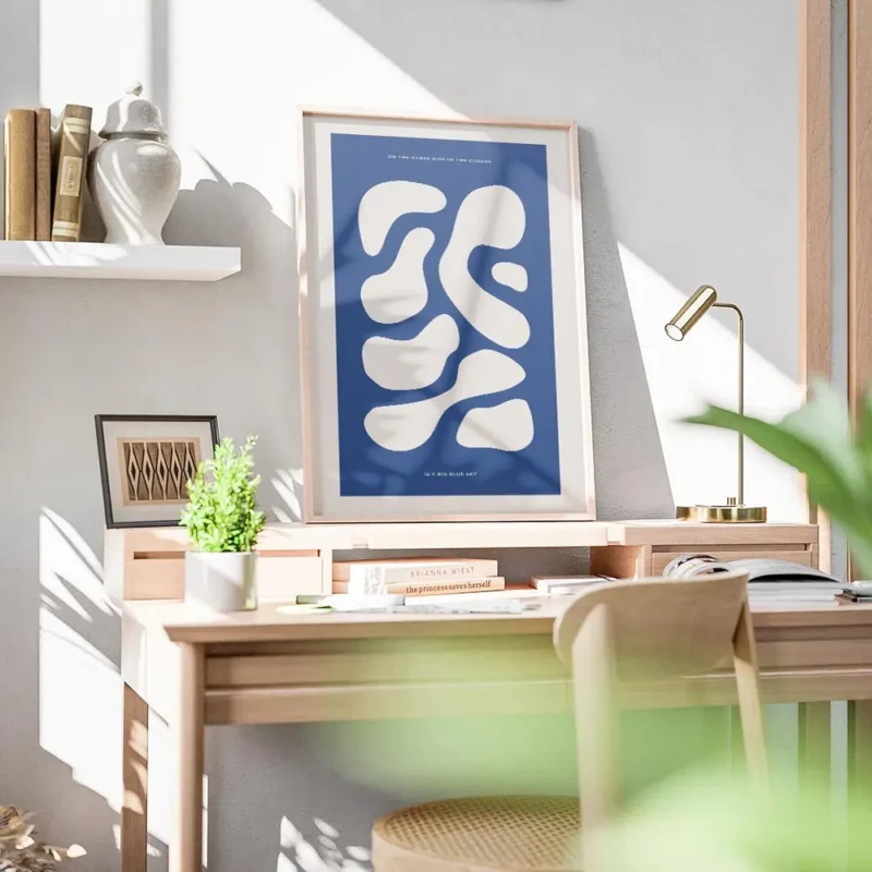 affiche avec des formes abstraites beige sur fond bleu fonce avec du texte en ty bureau.webp