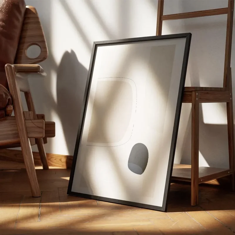 affiche avec des formes abstraites en gris clair beige et noir sur fond beige te encadre.webp