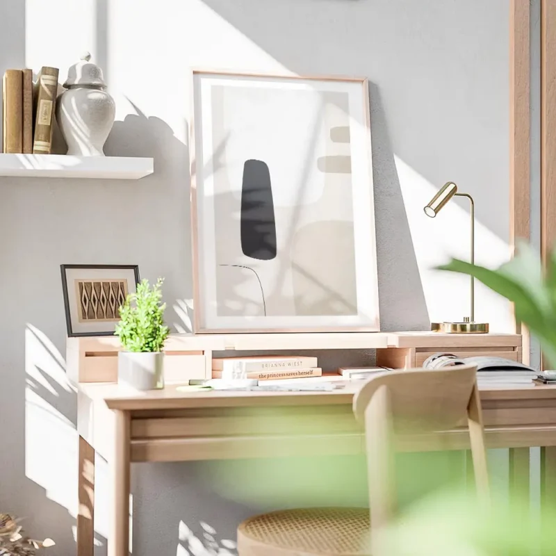 affiche avec des formes abstraites en noir gris clair et beige sur un fond beige bureau.webp