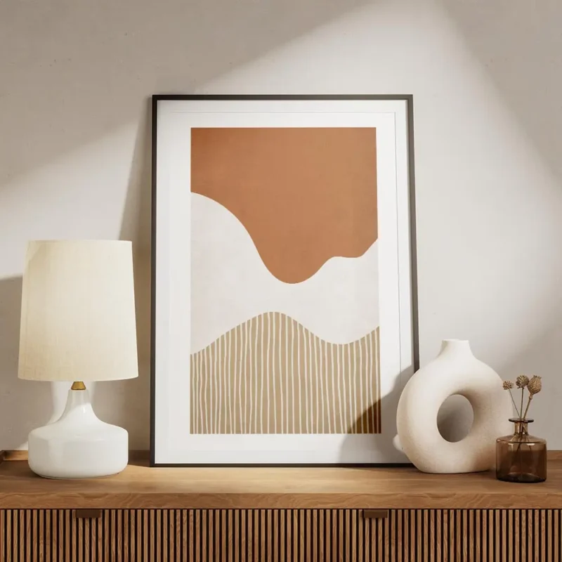 affiche avec des formes abstraites ondulees orange et blanches et des lignes ver meuble.webp
