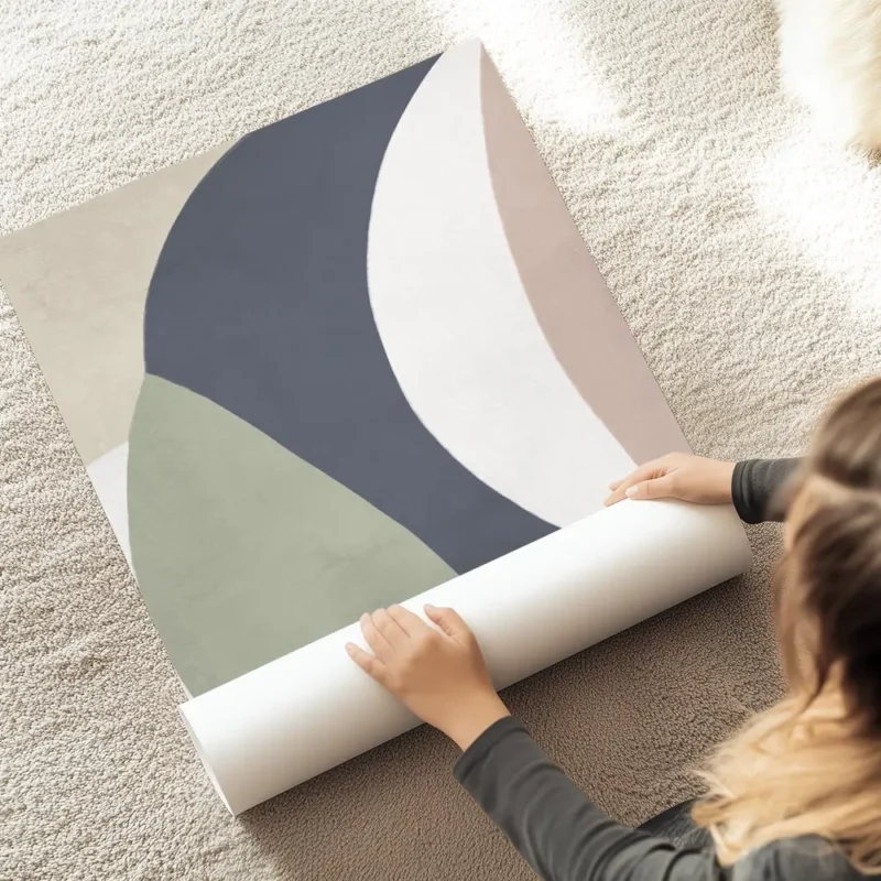 affiche avec des formes geometriques allongees aux couleurs sobres bleu vert ros au sol.webp