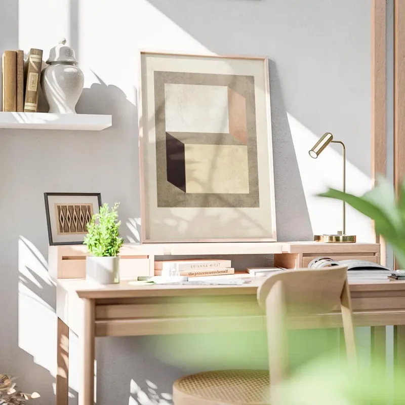 affiche avec des formes geometriques beige marron fonce et terracotta sur un fon bureau.webp