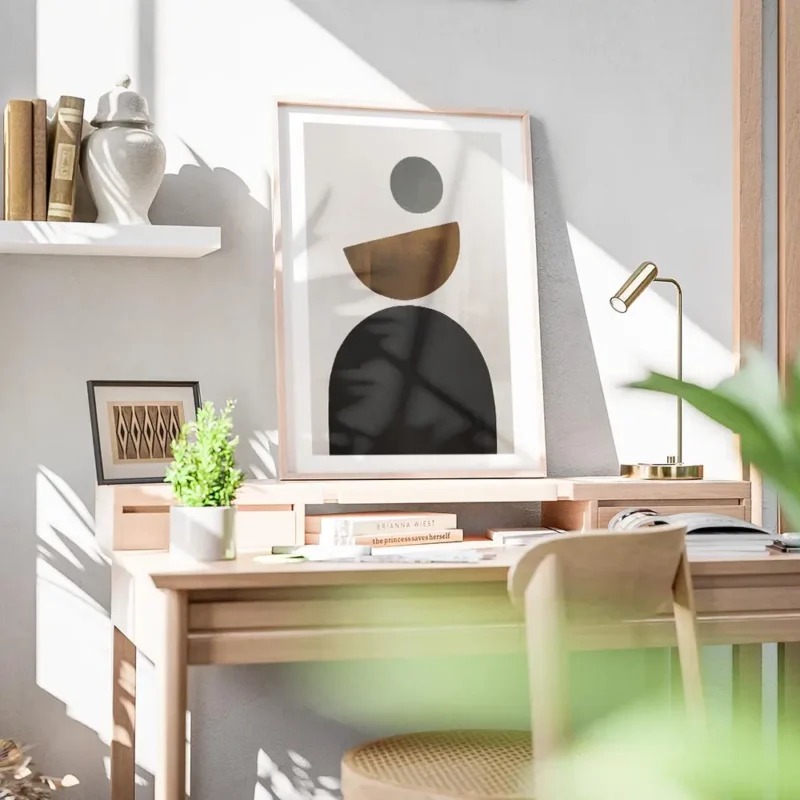 affiche avec des formes geometriques noires marron et grises sur un fond beige i bureau.webp