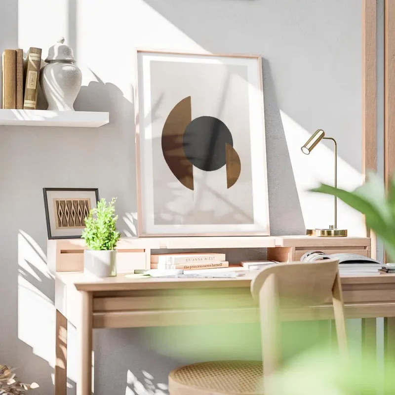 affiche avec des formes geometriques un cercle noir et des demi cercles marron s bureau.webp