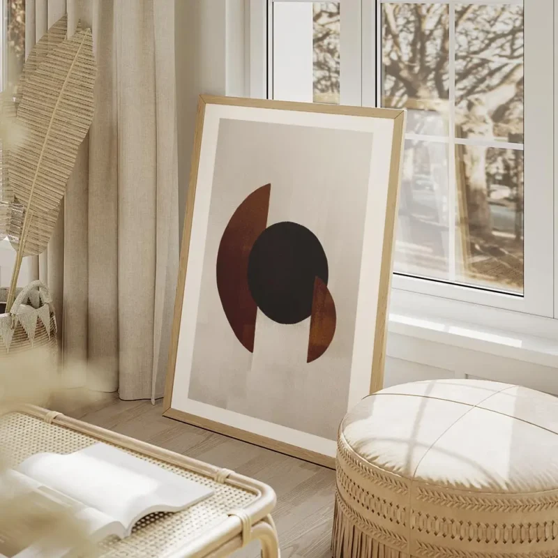 affiche avec des formes geometriques un cercle noir et des demi cercles marron s salon beige.webp