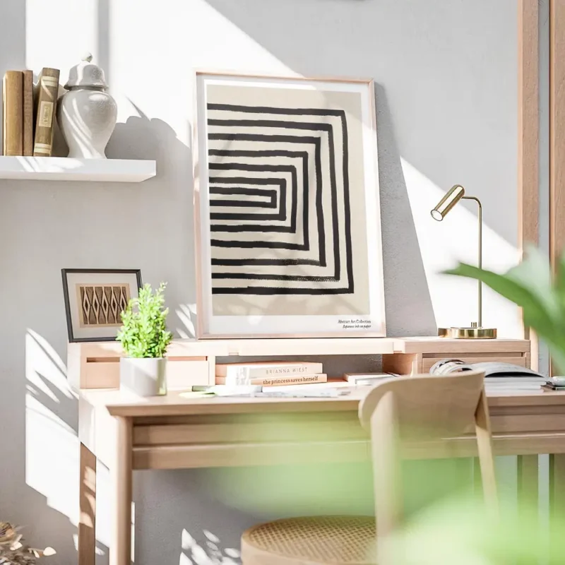 affiche avec des lignes noires formant un rectangle decentre sur un fond beige g bureau.webp