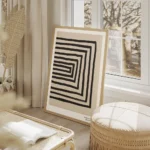 affiche avec des lignes noires formant un rectangle decentre sur un fond beige g salon beige.webp