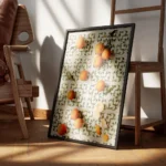 affiche avec des mandarines entieres une ouverte et des epluchures posees sur de encadre.webp