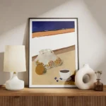 affiche avec des oranges dans un filet et une tasse de cafe style chic soleil ty meuble.webp