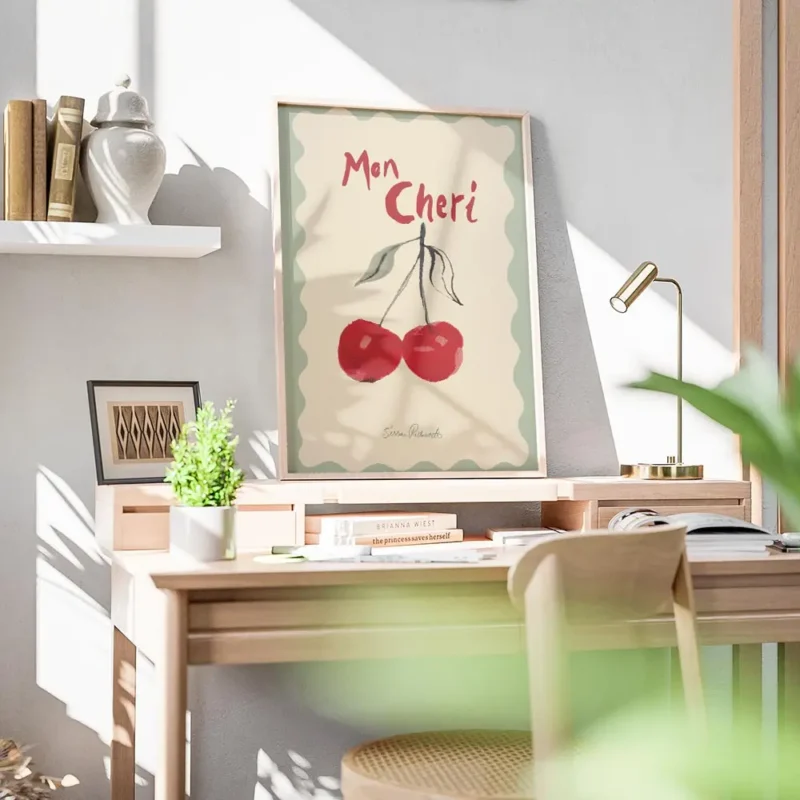 affiche avec deux cerises rouges peintes et le texte mon cheri en rouge sur un f bureau.webp
