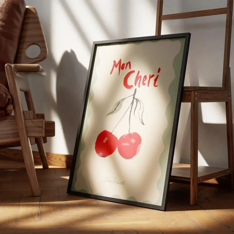 affiche avec deux cerises rouges peintes et le texte mon cheri en rouge sur un f encadre.webp
