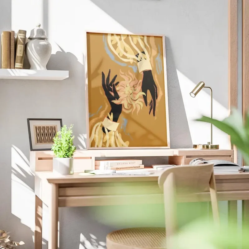 affiche avec deux mains noires tenant une fleur abstraite rose et jaune sur fond bureau.webp