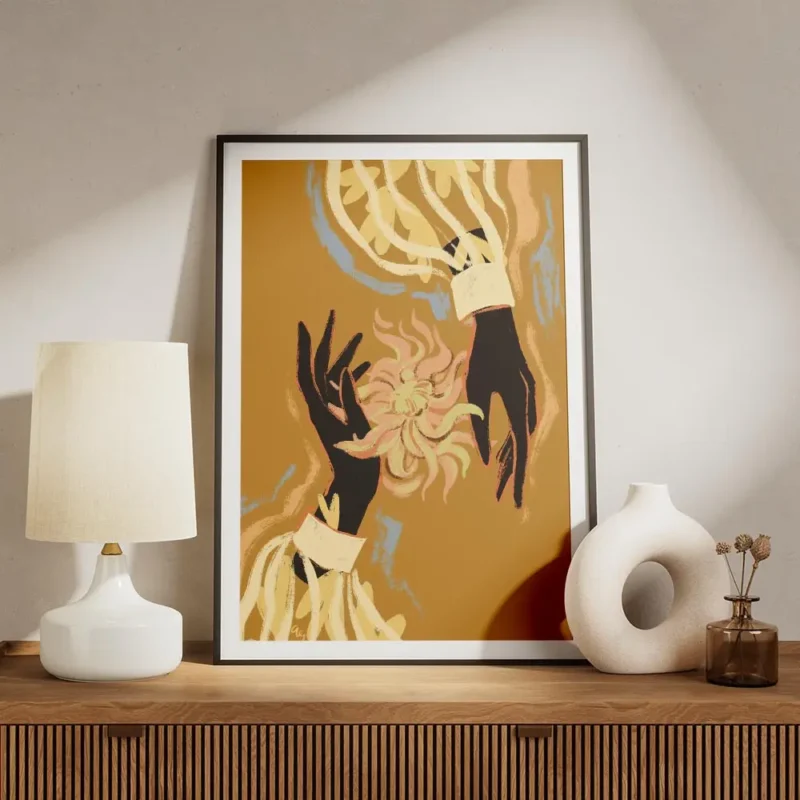 affiche avec deux mains noires tenant une fleur abstraite rose et jaune sur fond meuble.webp