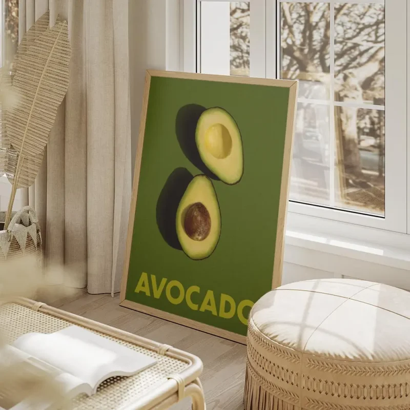 affiche avec deux moities davocat sur un fond vert fonce le texte avocado en bas salon beige.webp