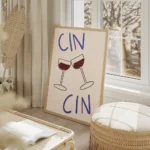 affiche avec deux verres de vin rouge qui trinquent et le texte cin cin en typog salon beige.webp