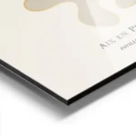 affiche avec formes abstraites beiges et contour dore typographie noire sur fond aluminium.webp