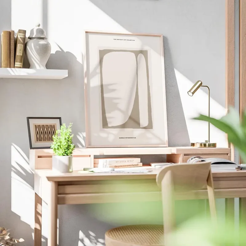 affiche avec formes abstraites beiges et marron sur fond beige typographie noire bureau.webp