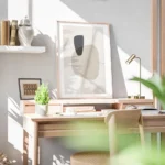 affiche avec formes abstraites en beige blanc et gris fonce sur fond texture ave bureau.webp