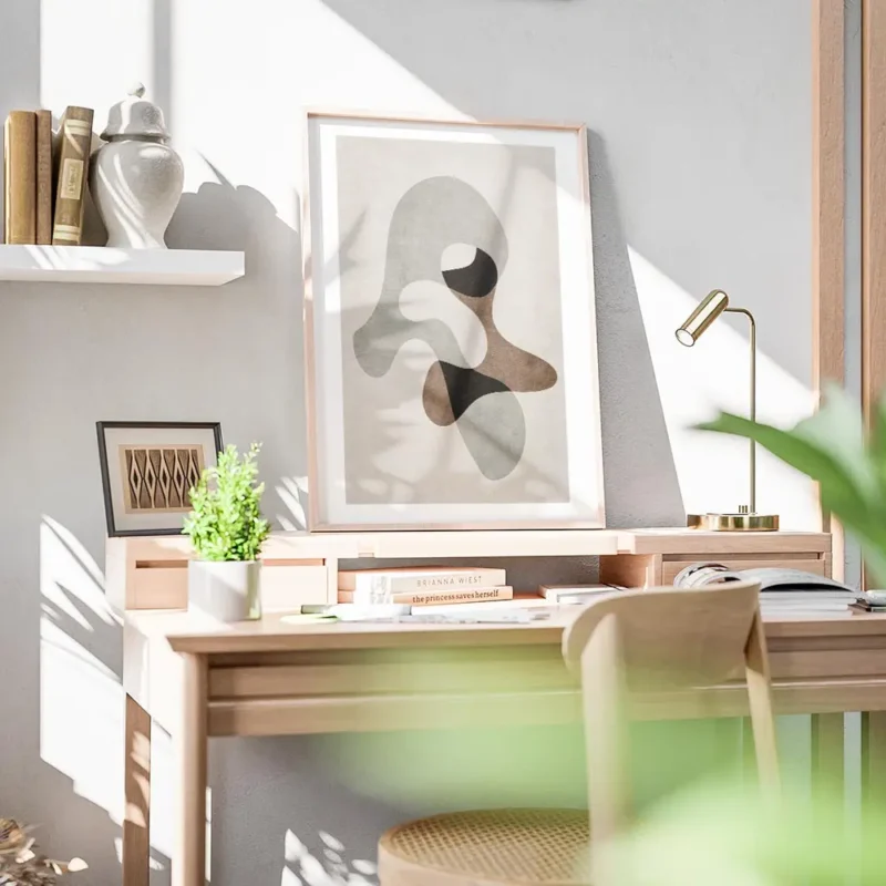 affiche avec formes abstraites grises marron et noires sur fond beige avec un ef bureau.webp