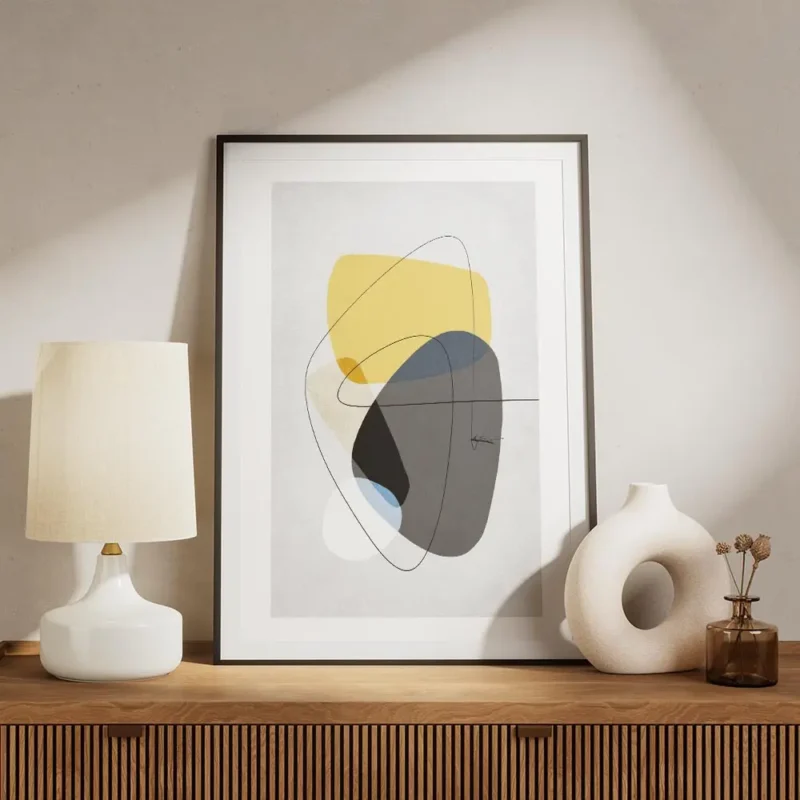 affiche avec formes abstraites jaunes et grises tourbillon noir et lignes fines meuble.webp
